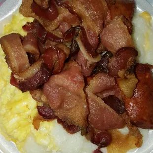 Eggs, cheese grits, bacon and smoked sausage. Less than $5. You can&apos;t beat that.