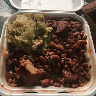 beans, cabbage, and meat in a styrofoam container
