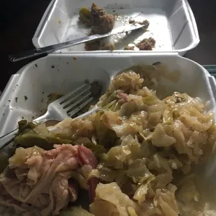 a plate of food with meat and cabbage