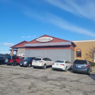 a row of cars in a parking lot