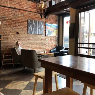 Relaxing with good coffee- hot enough for iced, nice artwork too. Love the brick walls.