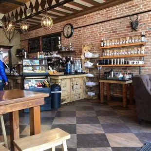 a woman standing in a coffee shop