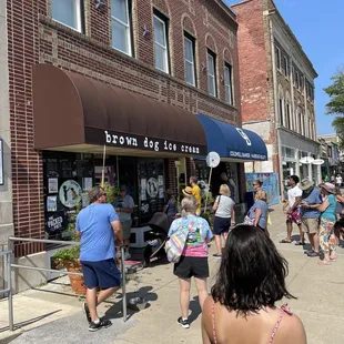 people walking down the sidewalk