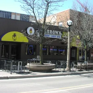 the outside of a building with a yellow awning
