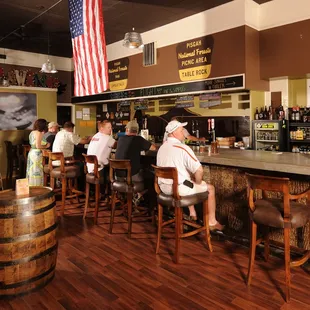 A view of the cozy 33-foot bar - one of the centerpieces of the shop.