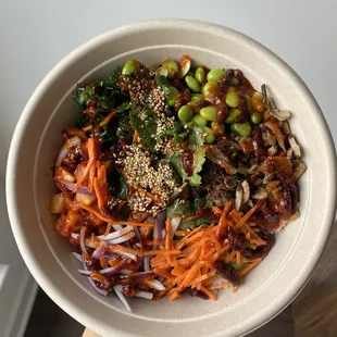 a person holding a bowl of food