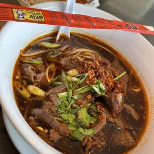 a bowl of beef and noodles