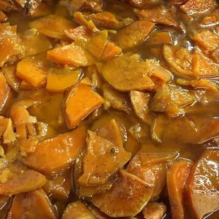 a pot of stew with carrots