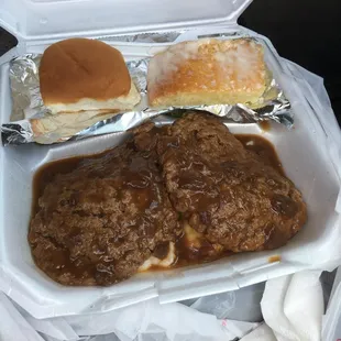 hamburger steak over mashed potatoes