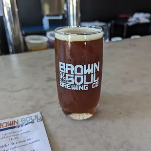 a pint of beer on a table