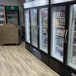 a row of refrigerators in a store