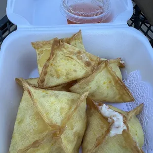 Crab Rangoon look and taste homemade, with a delicate thin dough and an inside with visible pink stuff that probably is crab.