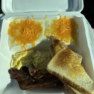 Bacon, scrambled eggs, cheese grits, and toast.