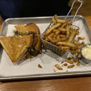 a basket of fries and a sandwich