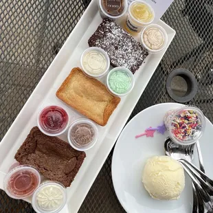 The brownie flight with a side of vanilla ice cream and sprinkles ;) tiny star wands provided by my four nager ;)