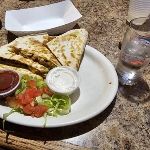 Chicken quesadilla with a side of double absolute spicy water