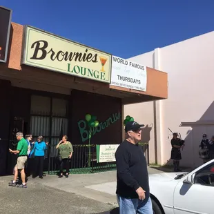 people standing outside of the building