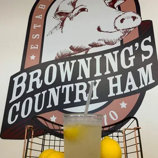a glass of lemonade and lemons