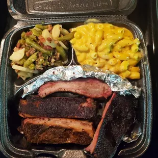 1 meat plate $15.  Ribs, macaroni &amp; cheese and green beans.