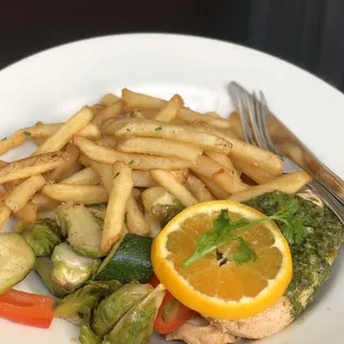 chicken breast with chimichurri sauce, vegetable medley, and garlic fries