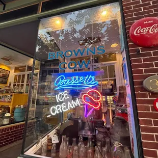 a neon sign in the window