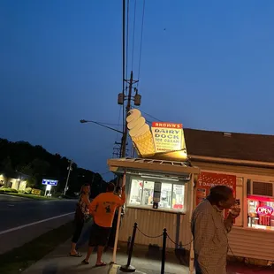 a man standing in front of a store