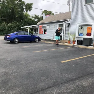 a blue car parked in a parking lot
