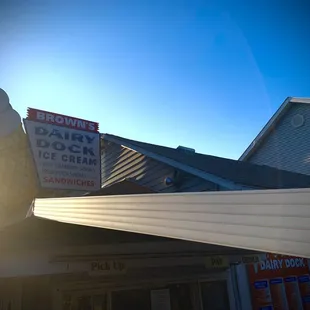 a large ice cream cone on top of a building