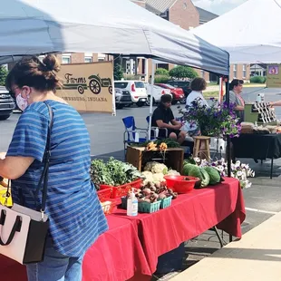 a woman buying vegetables