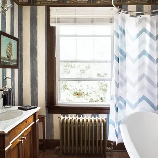 The Nautical Room. Queen room with Fireplace, Vizio Smart TV and private bath.