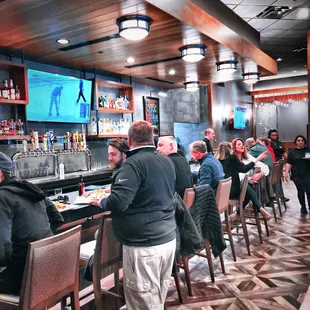 people sitting at the bar