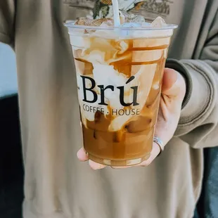 a person holding a cup of coffee