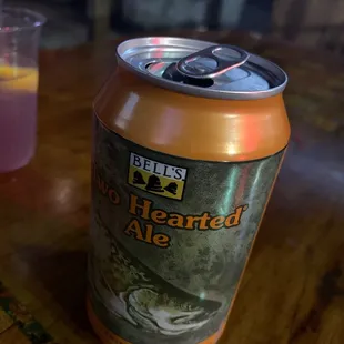 a can of beer on a table