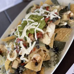 Grilled Chicken Nachos yummy! Well-balanced with toppings throughout!