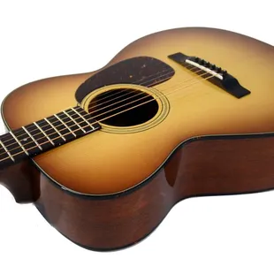 This is a 0-18 style guitar that I built, with a light sunburst and varnish finish.  Very big sounding for being 0 sized.