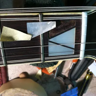 Replacing the Mother of Pearl inlay on a fingerboard