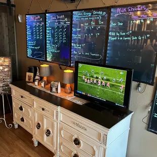 two televisions on the wall