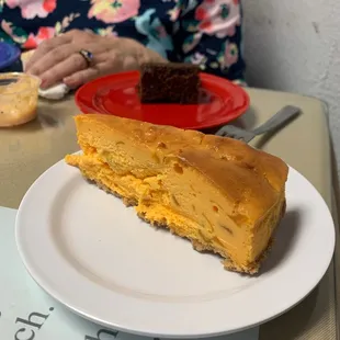 Main Street Mango Cheesecake, with chunks of mango, as good as it sounds. Brownie in the background.