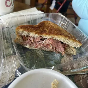 half of a grilled reuben