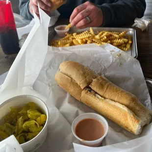 Two cheese steaks with a large fry! We only got 7 in sandwiches and they are pretty big  so it's worth it! The fries are amazing
