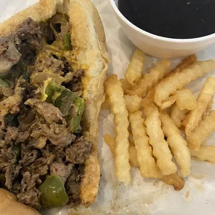 Supreme cheesesteak (not customized as I ordered), fresh fries, yummy au jus