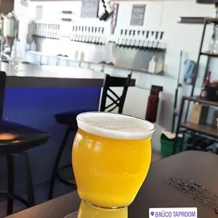 a glass of beer on a table