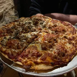 Thin crust sausage and mushroom pizza