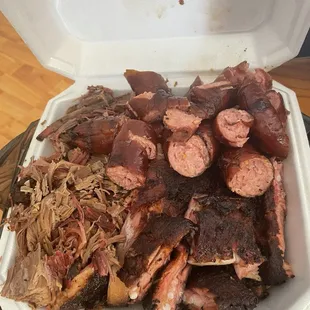 3 meat combo with brisket, sausage and ribs.