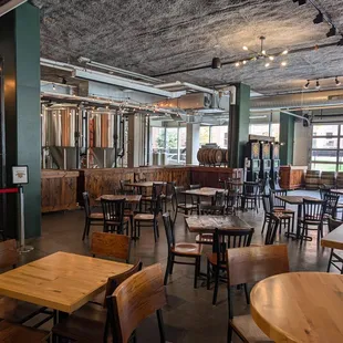 Large open taproom with axe throwing, darts, and lots of seating!