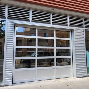 Large garage door on the exterior for easy access to food trucks and side walk seating