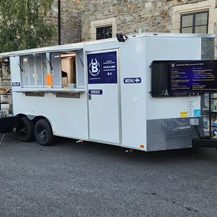 a food truck parked in front of a building