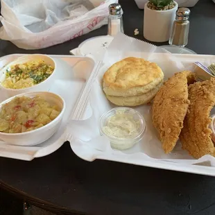 Fried catfish, potatoes and scrambled eggs.