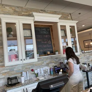 a woman standing at the counter