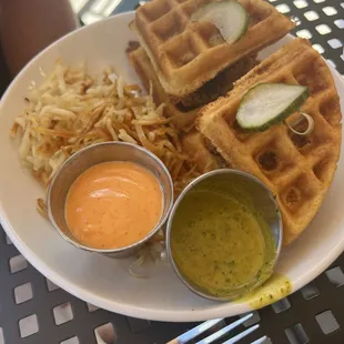 Chicken + waffles with hashbrowns. Orange sauce that came with it-- delicious!!!!!